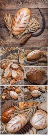 DesignOptimal Bread and wheat on wood background stock photo